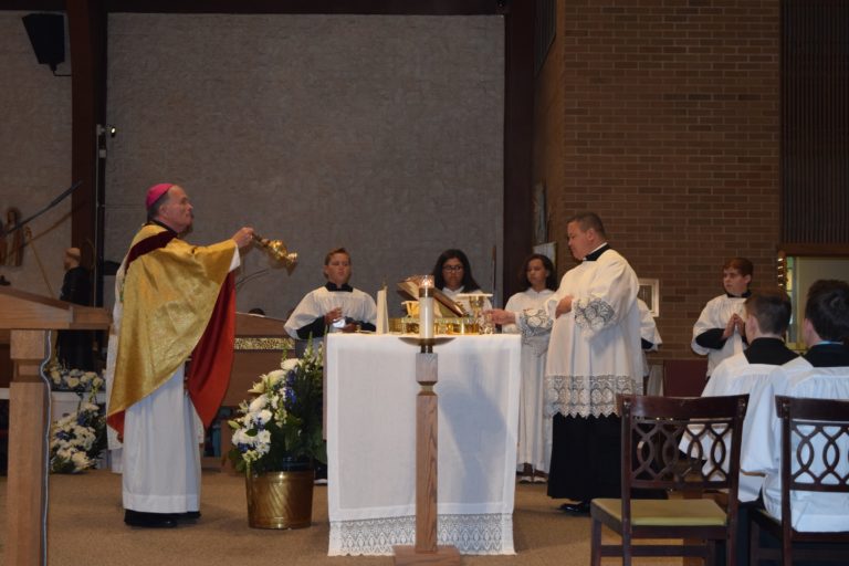 Bishop O'Connell Reverencing Altar